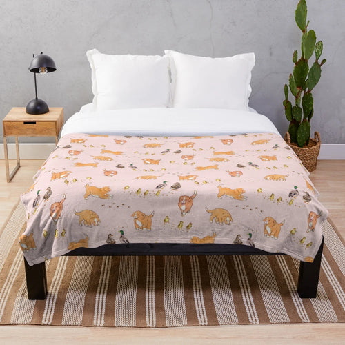 Soft pink plush blanket featuring cute cartoon illustrations of Nova Scotia duck tolling retriever puppies and mallard ducklings