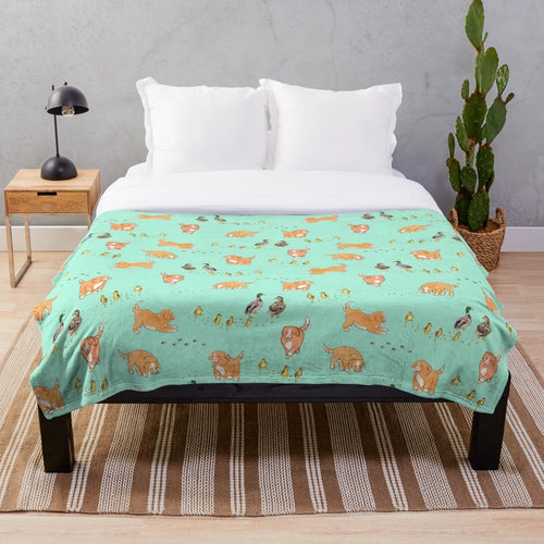 Toller puppy and duckling playing on a mint plush blanket with a sketch pattern design