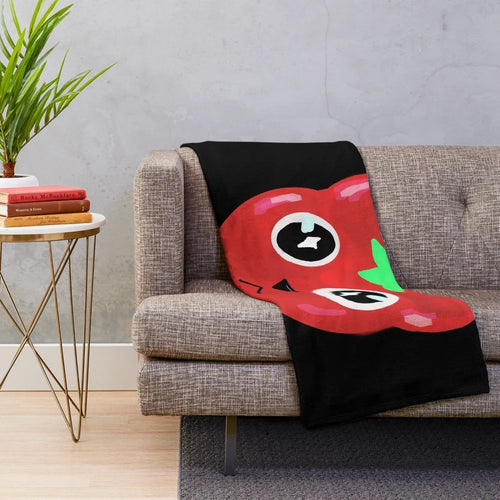 A cozy and cuddly plush blanket featuring an adorable tomato-shaped cat design