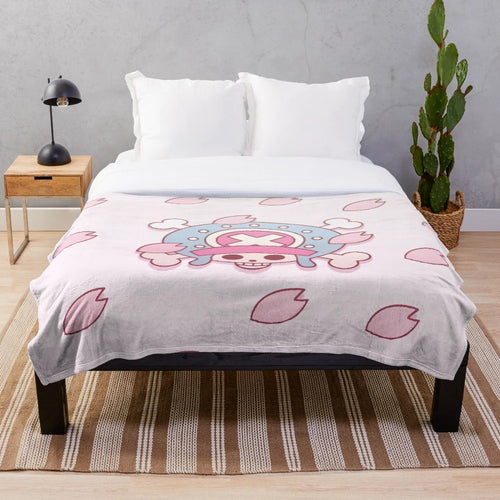 Soft and cuddly plush blanket featuring the beloved One Piece character Tony Tony Chopper surrounded by sakura blossoms