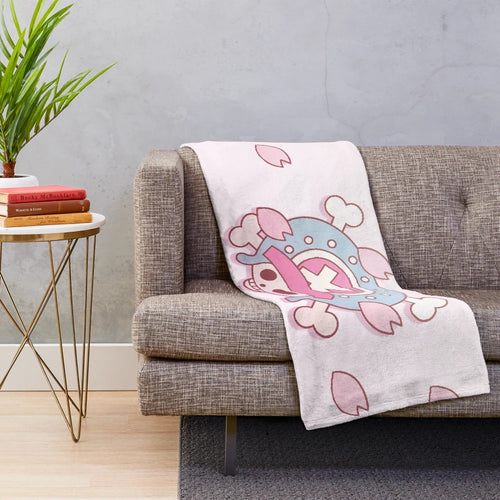 Soft and cuddly plush blanket featuring the beloved One Piece character Tony Tony Chopper surrounded by sakura blossoms