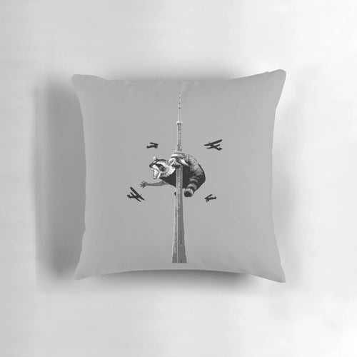 Soft, plush pillow featuring a playful Toronto raccoon, also known as a 'trash panda', against the iconic Toronto skyline.