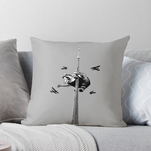 Soft, plush pillow featuring a playful Toronto raccoon, also known as a 'trash panda', against the iconic Toronto skyline.