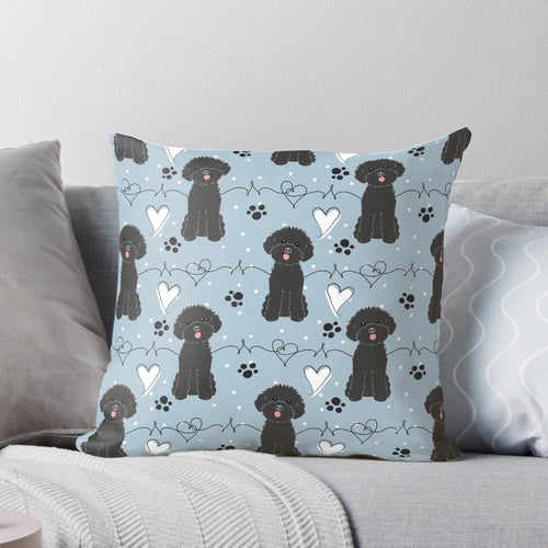 Soft, cuddly toy poodle pillow featuring a black poodle with a loving expression.