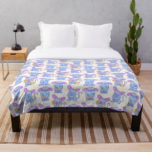 Tutter the blue mouse from Bear in the Big Blue House on a soft, plush blanket