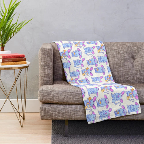 Tutter the blue mouse from Bear in the Big Blue House on a soft, plush blanket