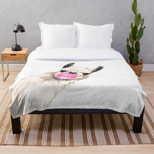 Watercolor illustration of a llama chewing bubble gum on a plush blanket