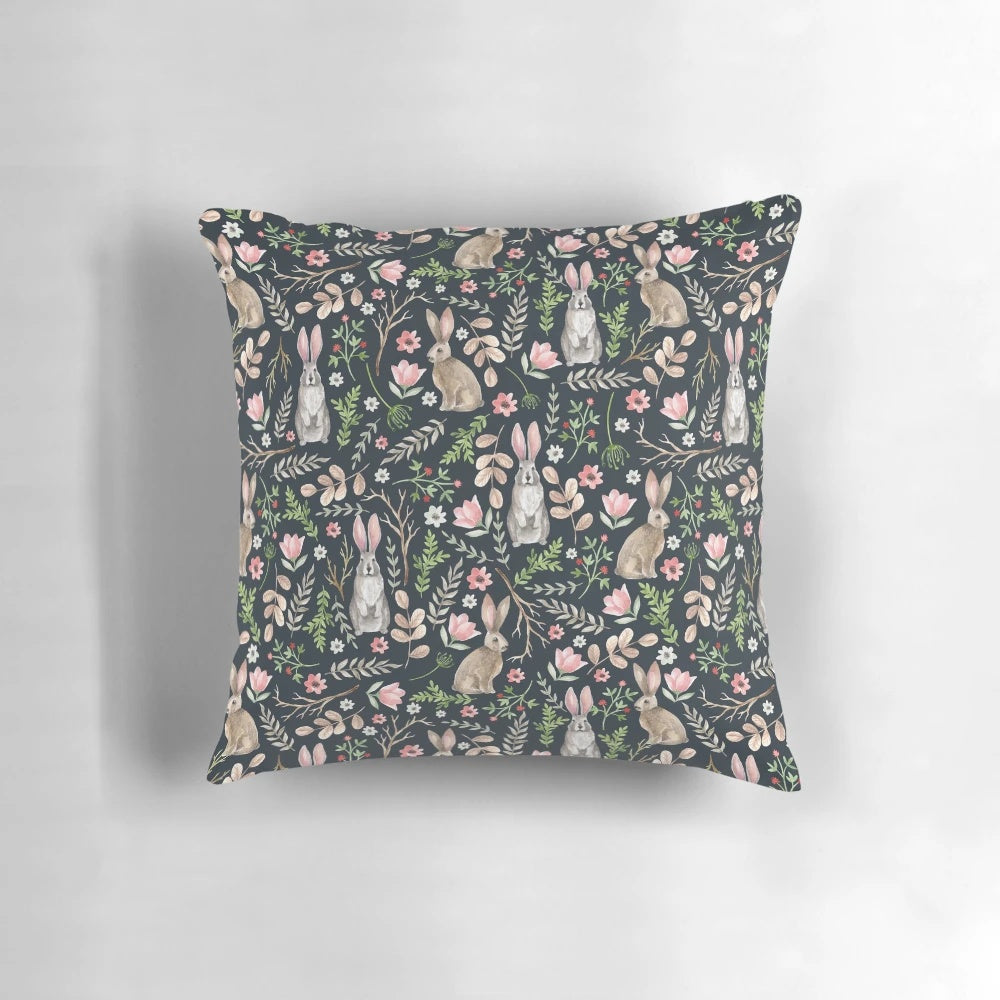 Beautifully designed pillow featuring a whimsical watercolor illustration of a cute blue rabbit surrounded by floral and nature elements.