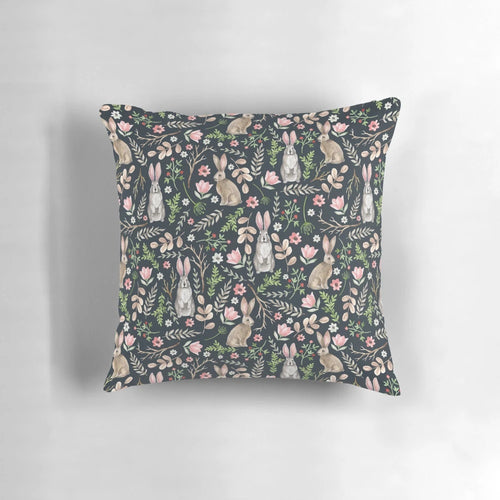 Beautifully designed pillow featuring a whimsical watercolor illustration of a cute blue rabbit surrounded by floral and nature elements.