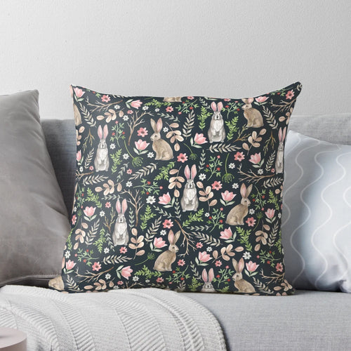 Beautifully designed pillow featuring a whimsical watercolor illustration of a cute blue rabbit surrounded by floral and nature elements.