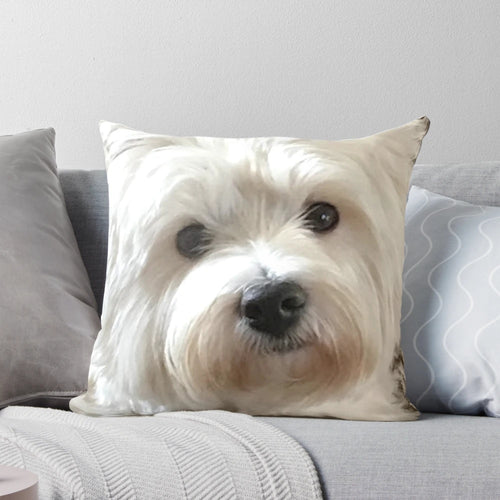 Soft, fluffy white Westie dog on a plush pillow, a perfect pet portrait accent for your home.