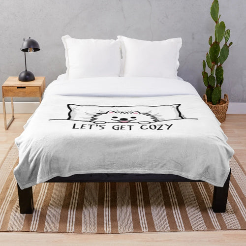 Cute cartoon-style white pomeranian dog on a plush blanket
