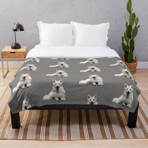 A soft and cozy plush blanket featuring a white Swiss shepherd dog