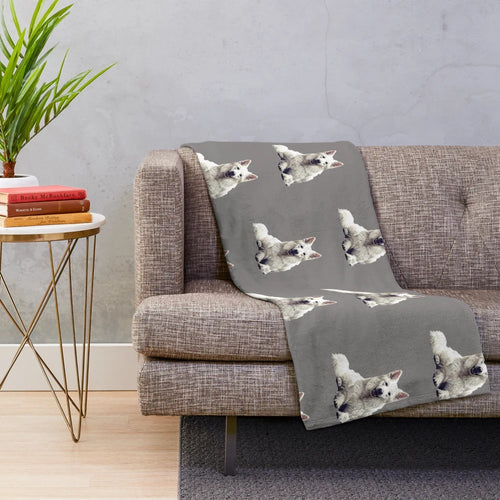 A soft and cozy plush blanket featuring a white Swiss shepherd dog