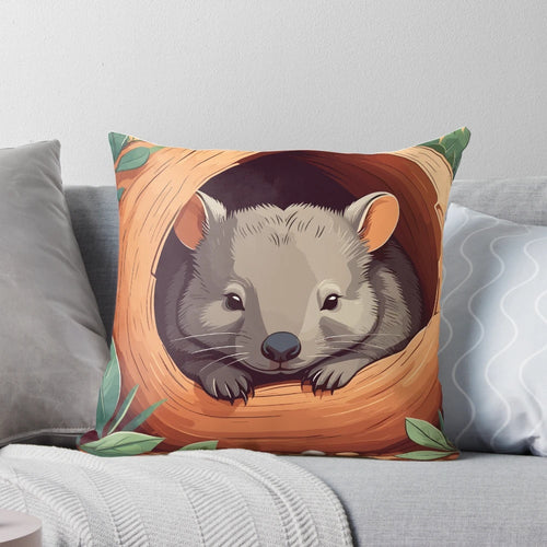 A decorative throw pillow featuring a cute, cartoon-style illustration of a wombat, a beloved Australian marsupial.