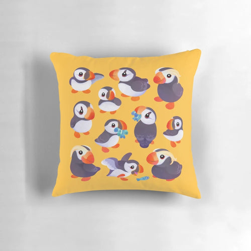 A soft, yellow throw pillow featuring a cute, kawaii puffin bird design