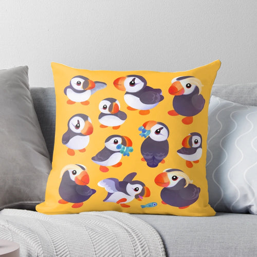 A soft, yellow throw pillow featuring a cute, kawaii puffin bird design