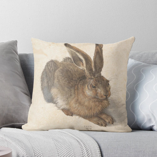 Soft, plush pillow featuring the famous "Young Hare" painting by Albrecht Dürer
