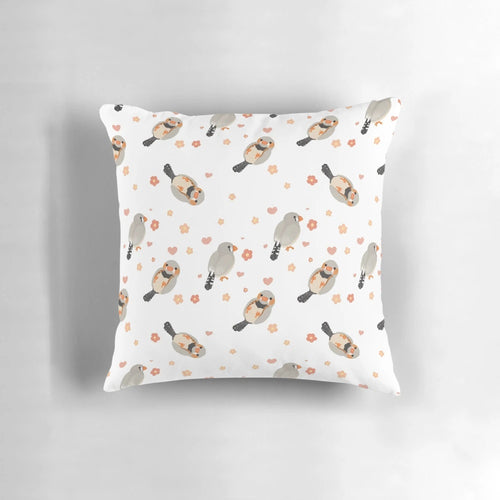Pillow featuring a colorful pattern of zebra finches and flowers