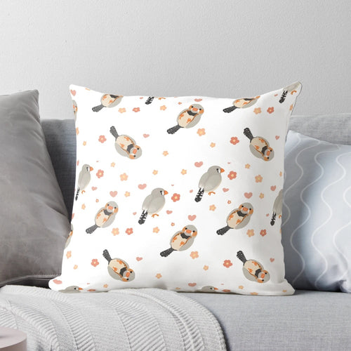 Pillow featuring a colorful pattern of zebra finches and flowers