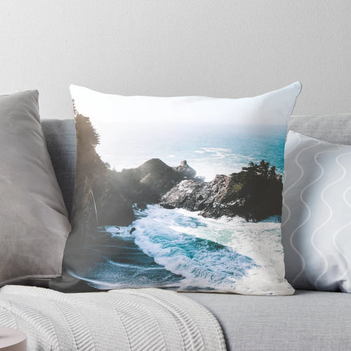 Outdoor pillow with a stunning waterfall and coastal design