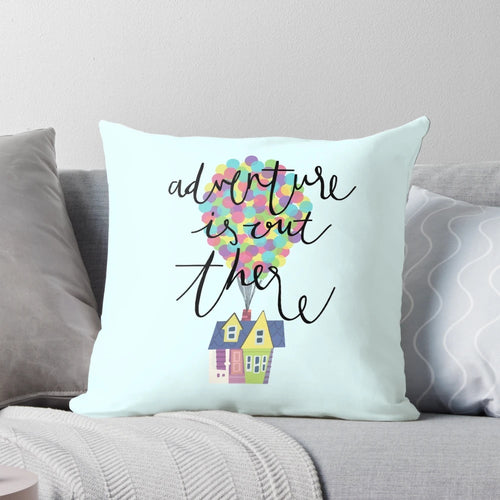Colorful decorative pillow featuring hand-lettered "Adventure is out there" design inspired by the Disney Pixar movie Up.