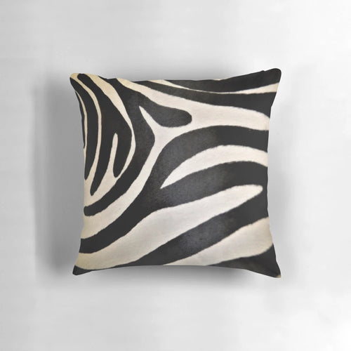 Decorative pillow featuring a vibrant black and white zebra stripe pattern, perfect for an African-inspired home decor.