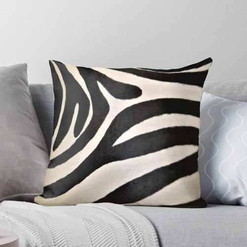 Decorative pillow featuring a vibrant black and white zebra stripe pattern, perfect for an African-inspired home decor.