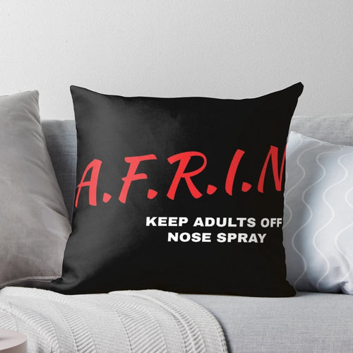 AFRIN Nasal Spray bottle on a soft, comfortable pillow