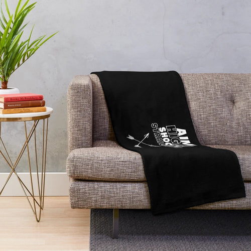 Archery-themed plush blanket with arrows and bullseye design