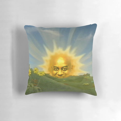 Ainsley Harriott's face photoshopped onto a sun-shaped pillow, featuring a funny, spicy expression.