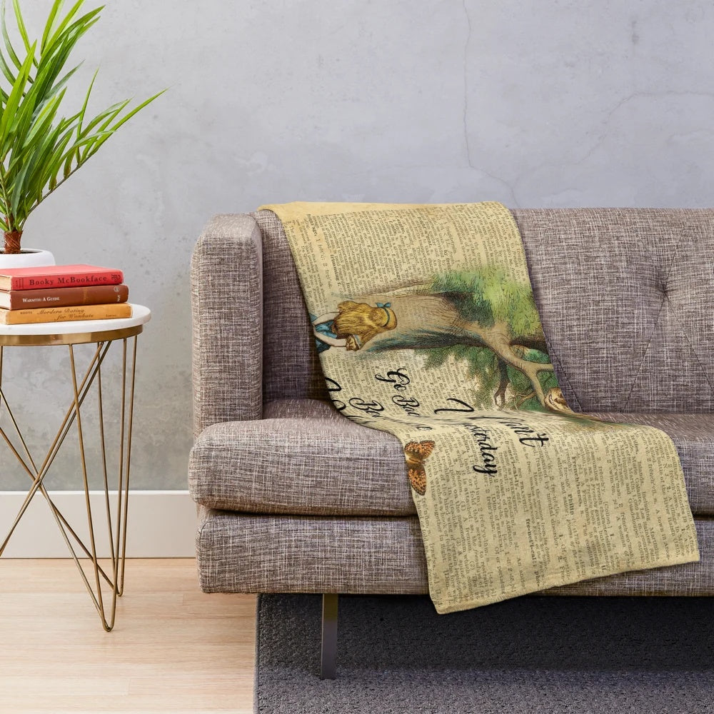 Vintage dictionary art plush blanket featuring the Cheshire Cat from Alice in Wonderland