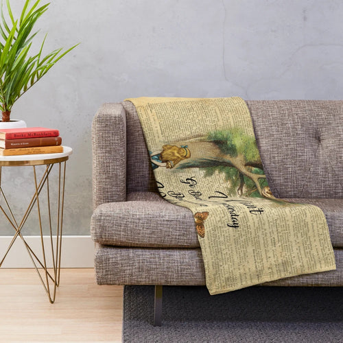 Vintage dictionary art plush blanket featuring the Cheshire Cat from Alice in Wonderland