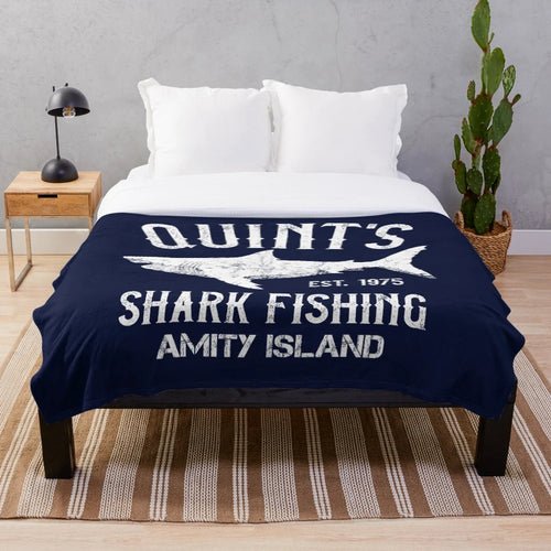 Vintage-style plush blanket inspired by the classic movie Jaws, featuring a shark fishing scene