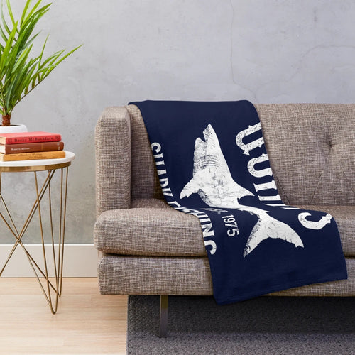 Vintage-style plush blanket inspired by the classic movie Jaws, featuring a shark fishing scene