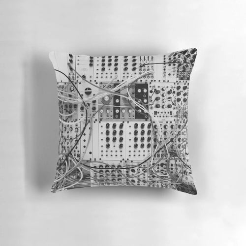 Stylish black and white pillow featuring an analog synthesizer with a modular design, perfect for music studios and vintage technology enthusiasts.