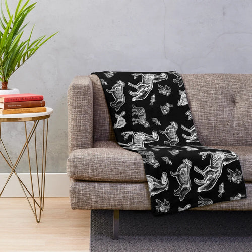 Plush blanket featuring an x-ray anatomy design of animal bones and skeletons