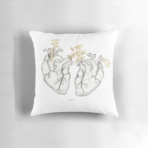 Anatomical heart-shaped pillow with a botanical, floral design