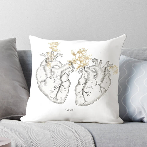 Anatomical heart-shaped pillow with a botanical, floral design