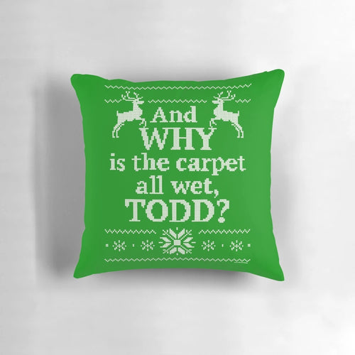 A vintage-style decorative pillow featuring the iconic "And Why Is the Carpet All Wet, Todd?" quote from the beloved Christmas comedy movie "Christmas Vacation".