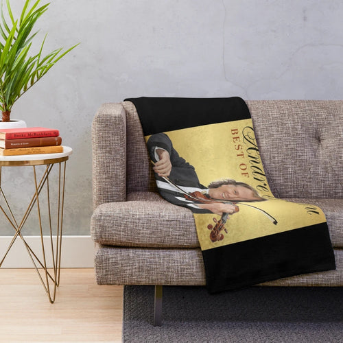 Soft and cozy plush blanket featuring album cover designs from André Rieu's best of collection