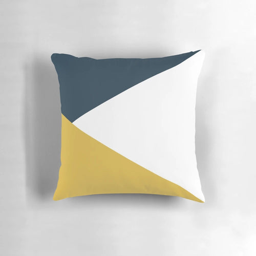 Angled color block pillow with navy blue, light mustard yellow, and white geometric design