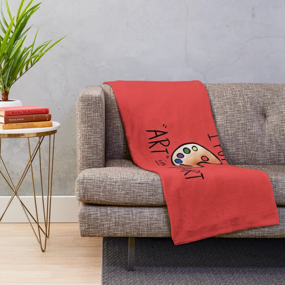 Plush blanket with 'I put the art in fart' design, featuring a fun artistic pun