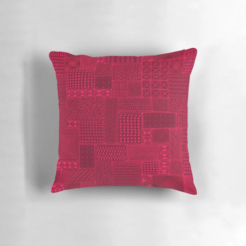 A vibrant red and black tribal-inspired mud cloth design decorative pillow for African-themed home decor.
