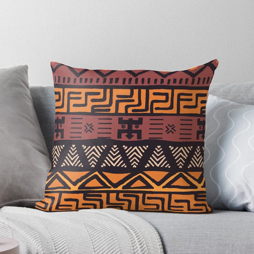 Throw pillow featuring an authentic African tribal mudcloth pattern in earth tones
