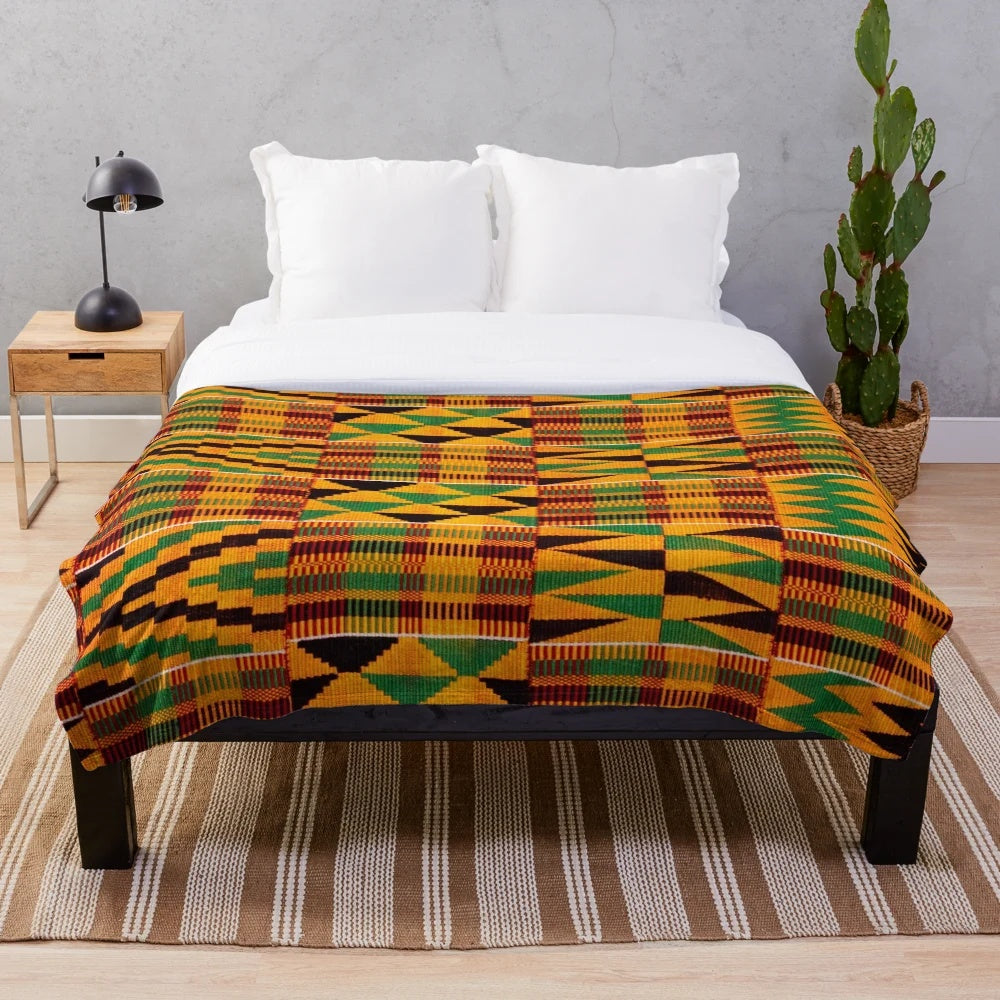 Plush African blanket featuring an authentic kente cloth pattern design