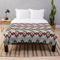 Plush blanket featuring native American-inspired artwork and designs