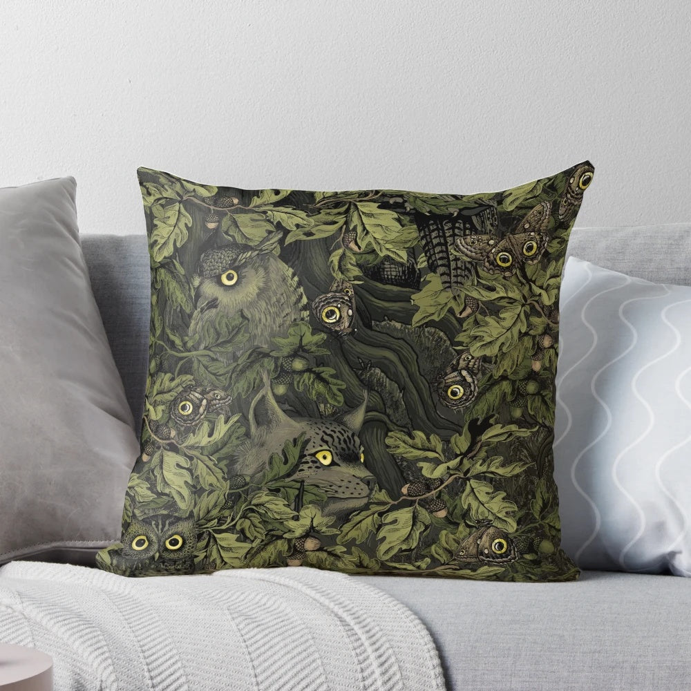 Olive green pillow with autumn leaves, oak acorns, and a camouflage pattern inspired by nature.