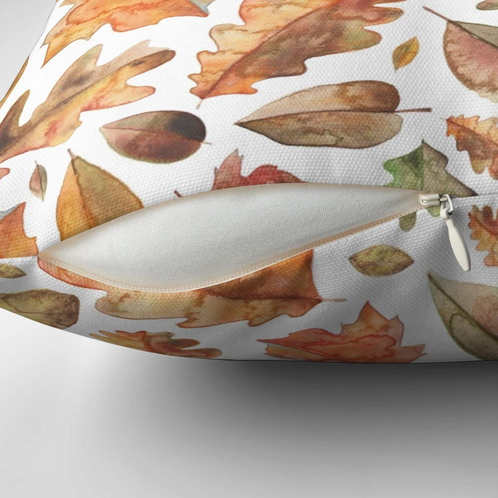 Autumn leaves watercolor design printed on a soft, plush pillow