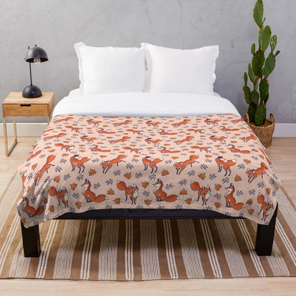 Red foxes print on a cozy, plush blanket